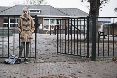 girl standing at school gates